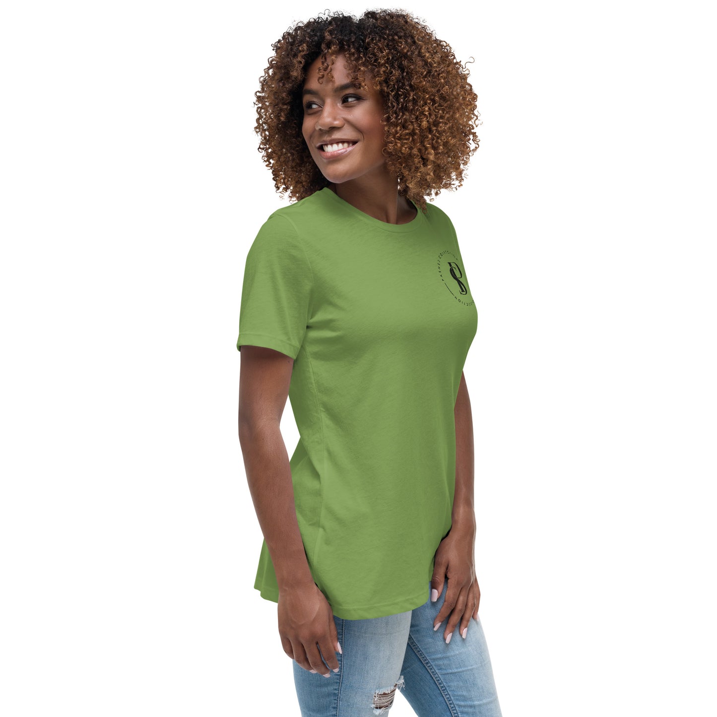 a woman in a green shirt smiles at the camera
