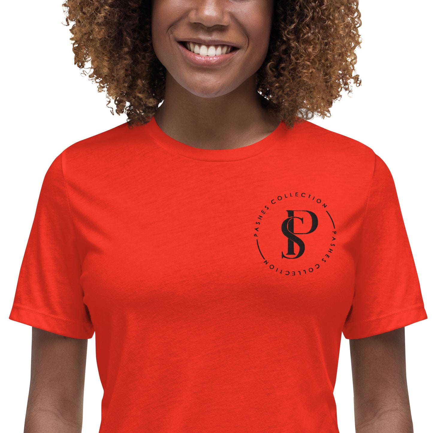 a woman wearing a red t - shirt with the letter p on it